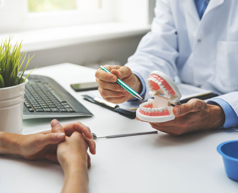 dentist consulting with patient