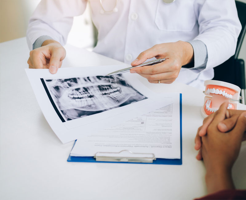 dentist consulting with patient